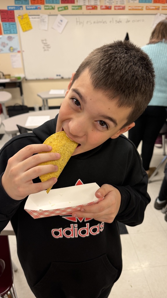 Student eating a taco