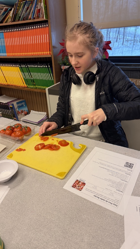 Student chopping vegetables