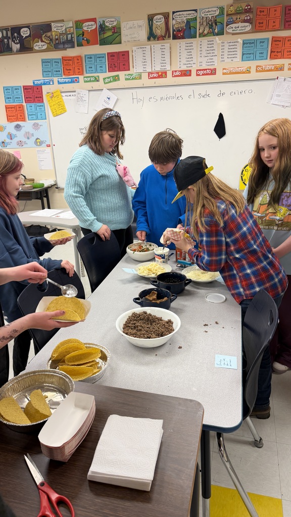 Students working together to make tacos