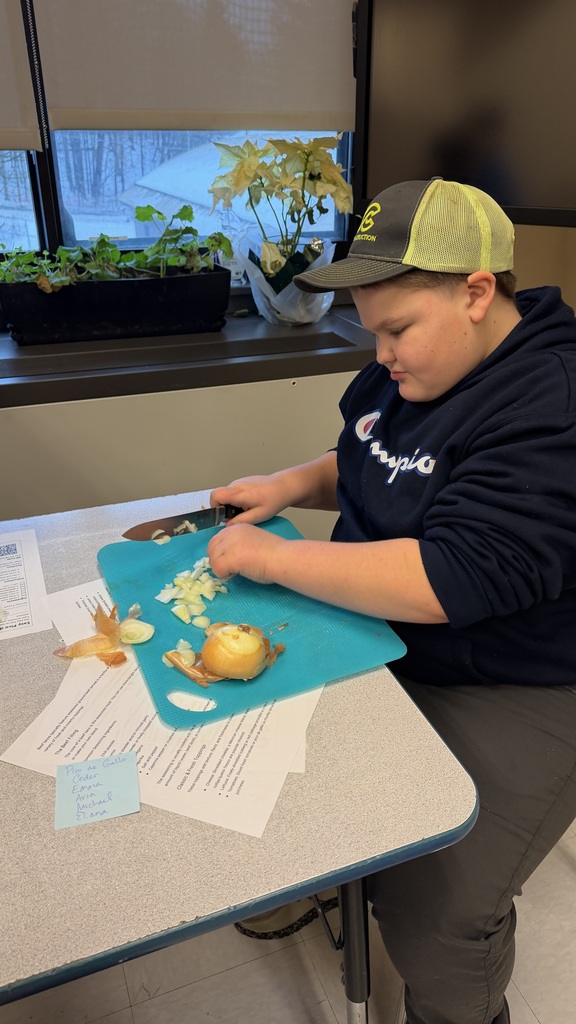 Student chopping vegetables