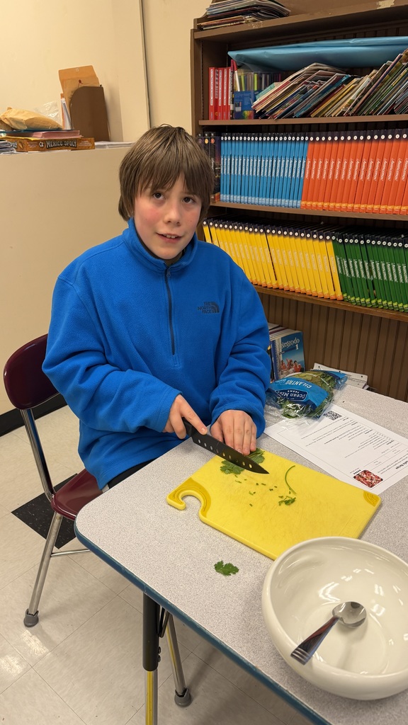 Student chopping vegetables