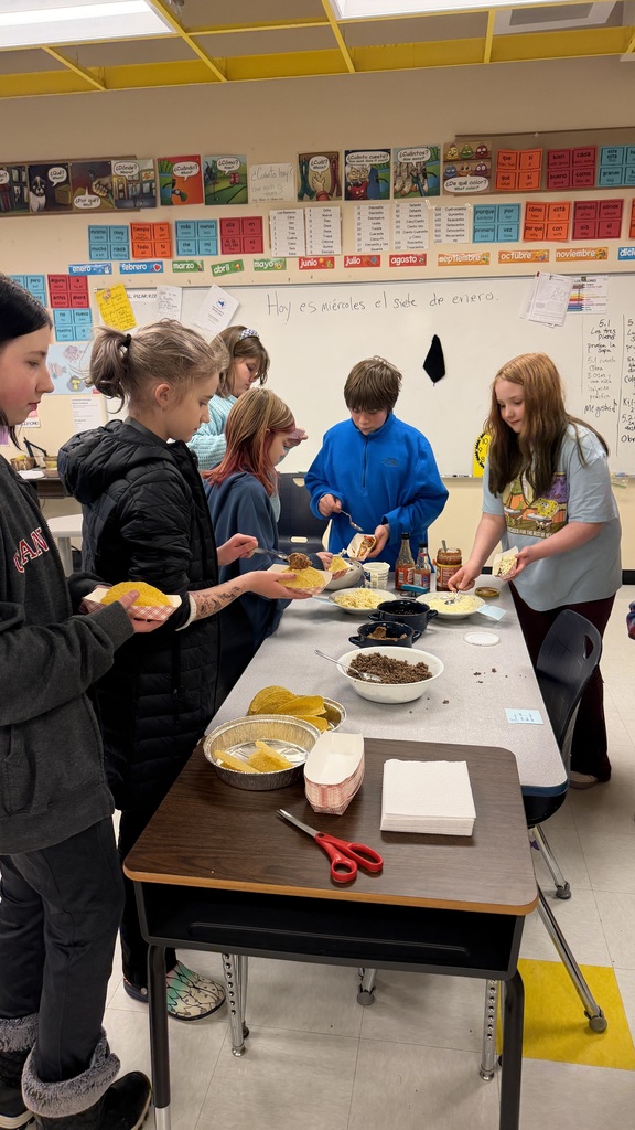 Students working together to make tacos