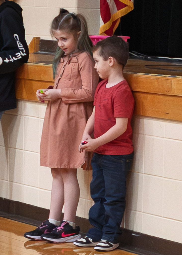 Students standing near the stage