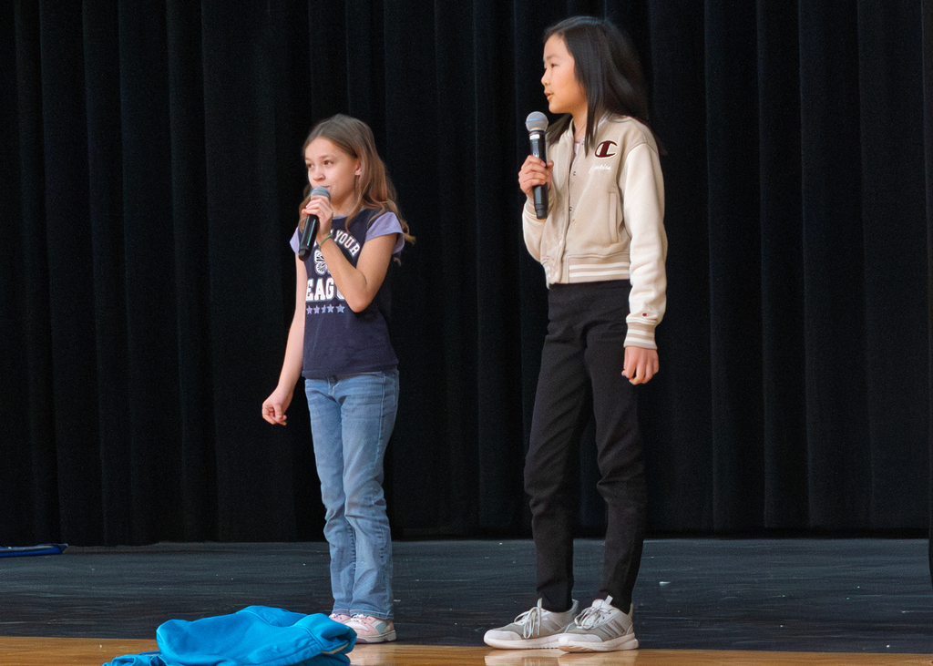 Students singing on stage