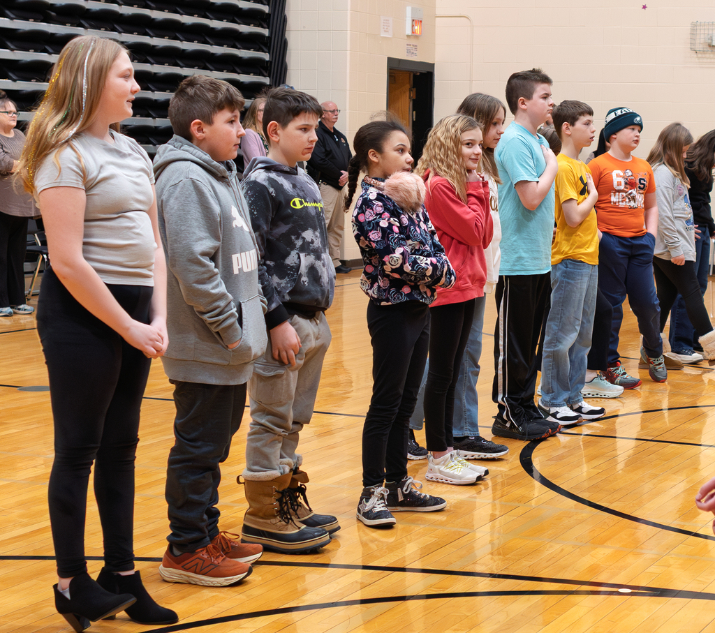 Students standing for the pledge