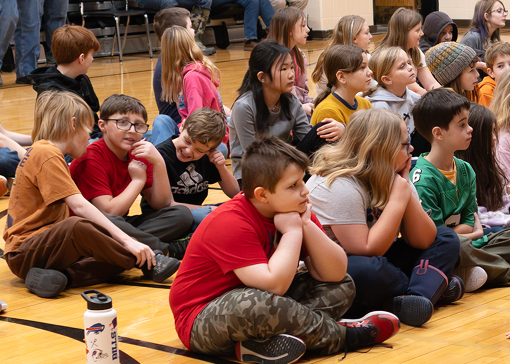 Students in the audience listen