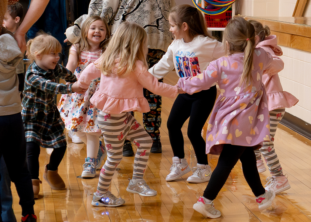 Students dancing in a circle
