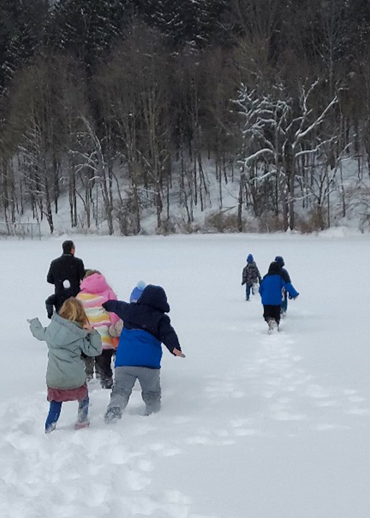 The class walking outside to gather snow