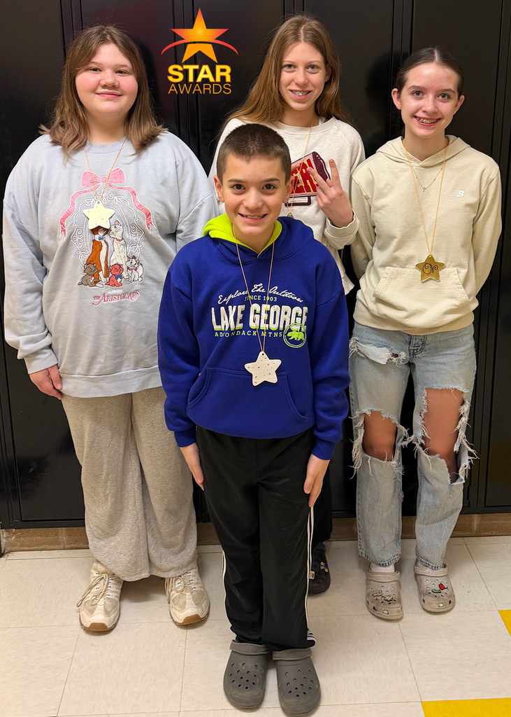 Four January star award student winners standing in the hall