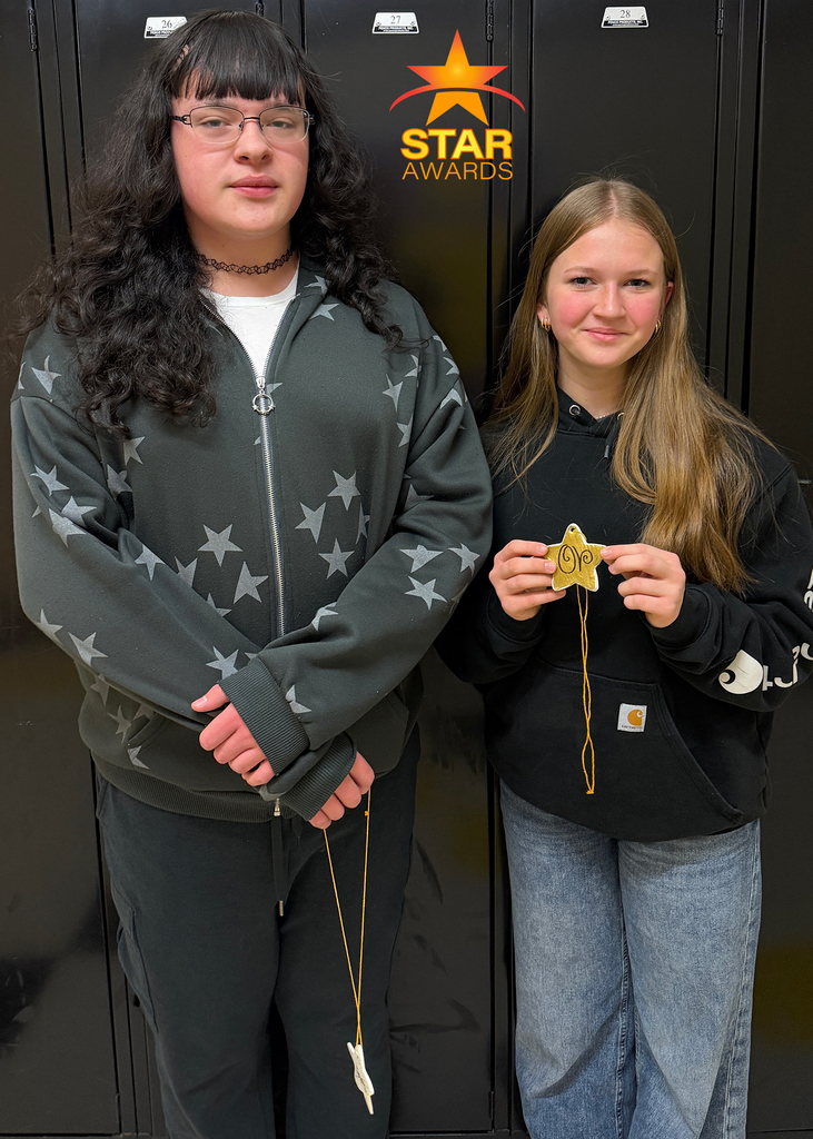 Two January student award winners standing in the hall