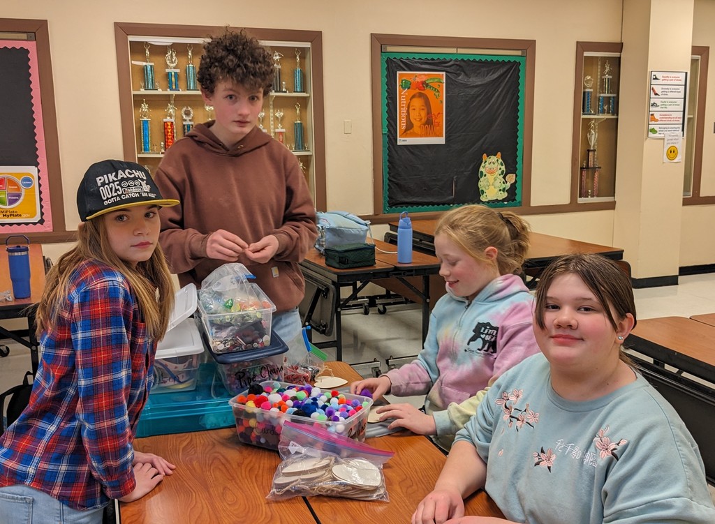 Students organize craft materials while working with Colgate mentors.