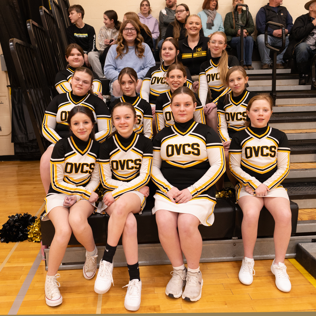 The OV Cheerleaders sitting on the bleachers