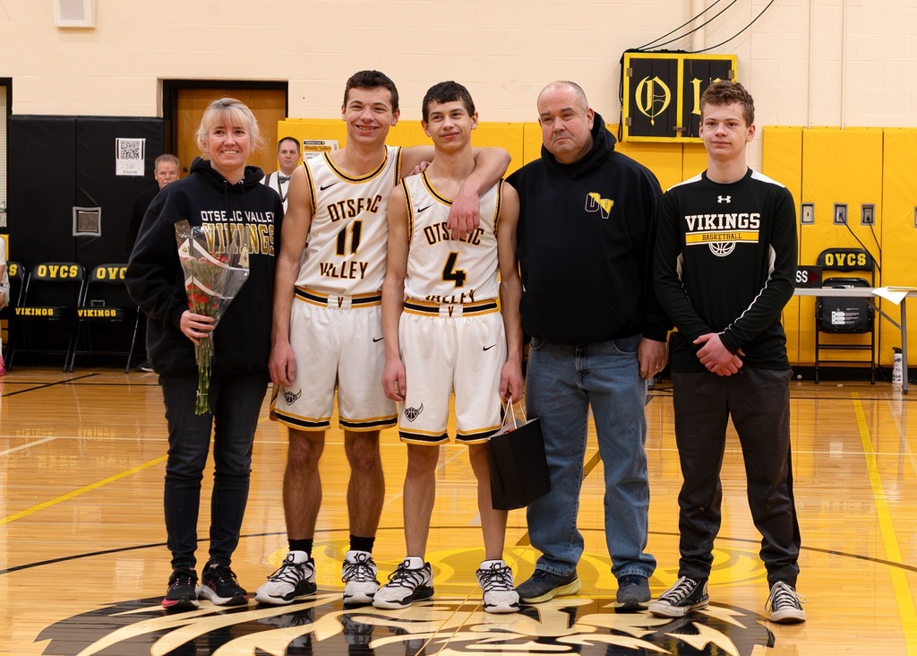 Gage Foster #4 and his family on senior recognition night at Otselic Valley