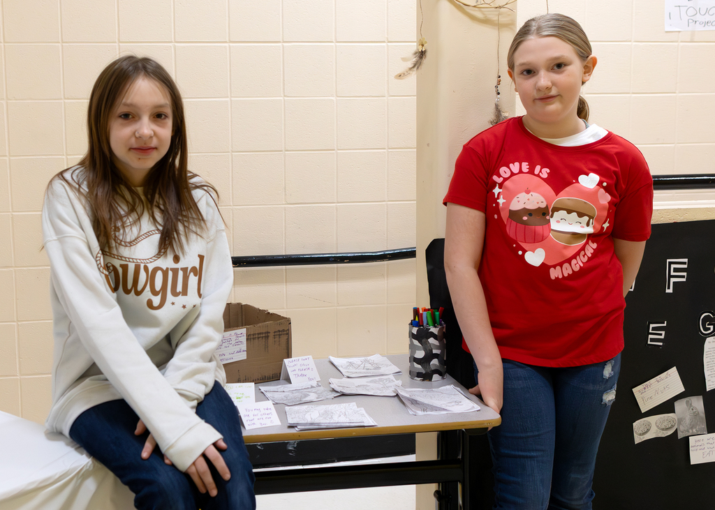 Two students pose with their projects