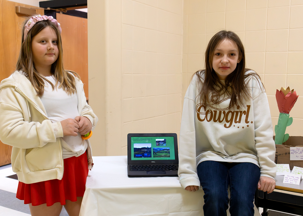Two students pose with their project