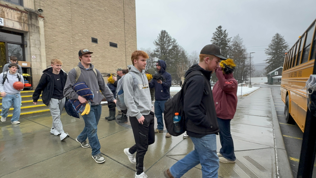 OV Boys Varsity Basketball team boarding the bus earlier today as students, staff, and community members gathered to send them off to their sectional game.