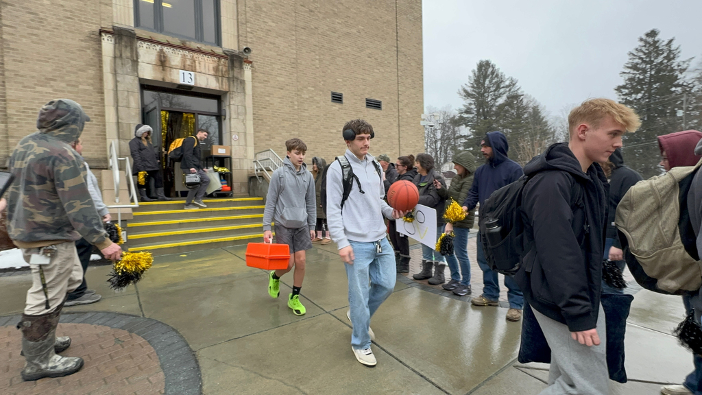 OV Boys Varsity Basketball team boarding the bus earlier today as students, staff, and community members gathered to send them off to their sectional game.