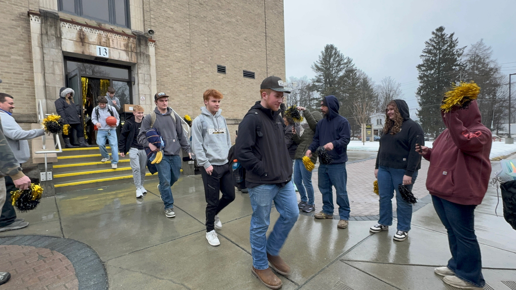 OV Boys Varsity Basketball team boarding the bus earlier today as students, staff, and community members gathered to send them off to their sectional game.
