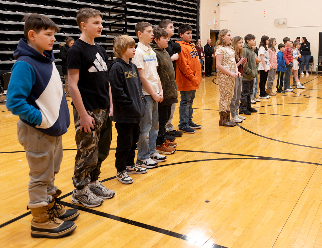 Students standing for the song