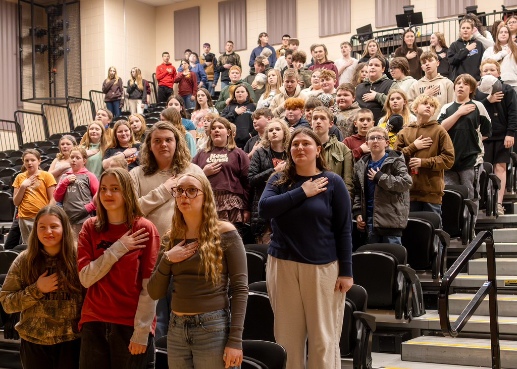 Audience members saying the pledge