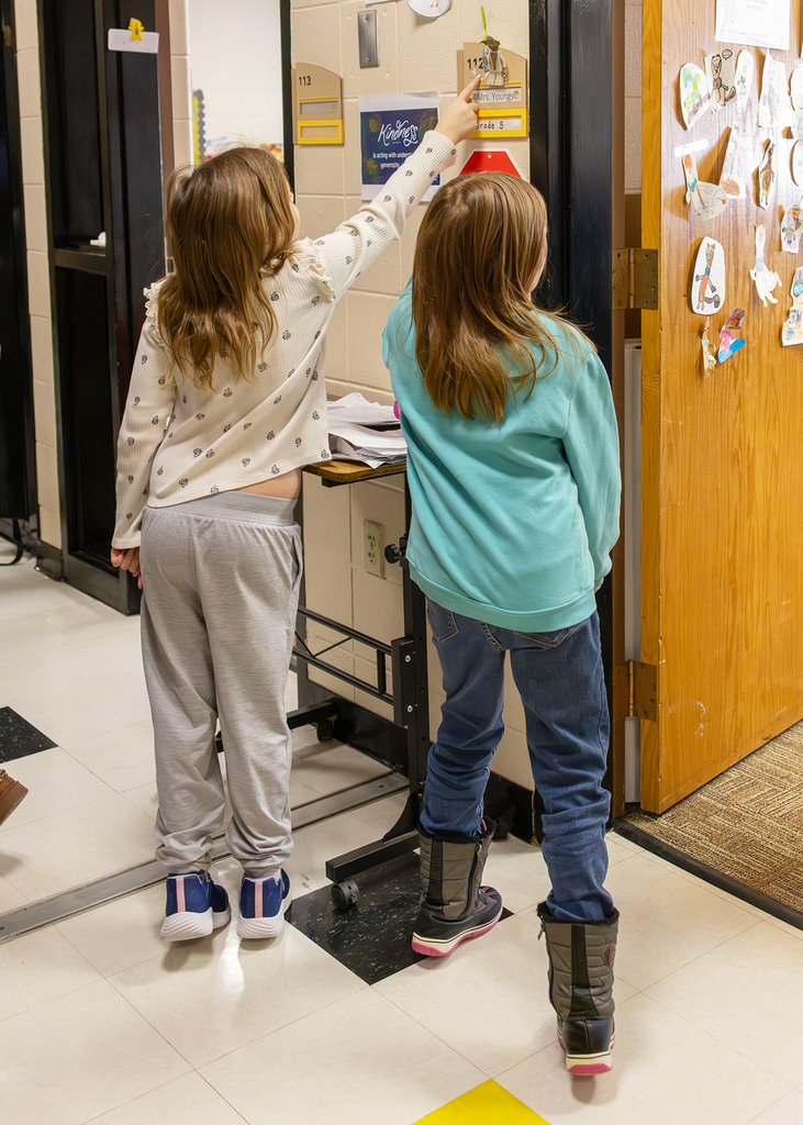 Students learning about Braille