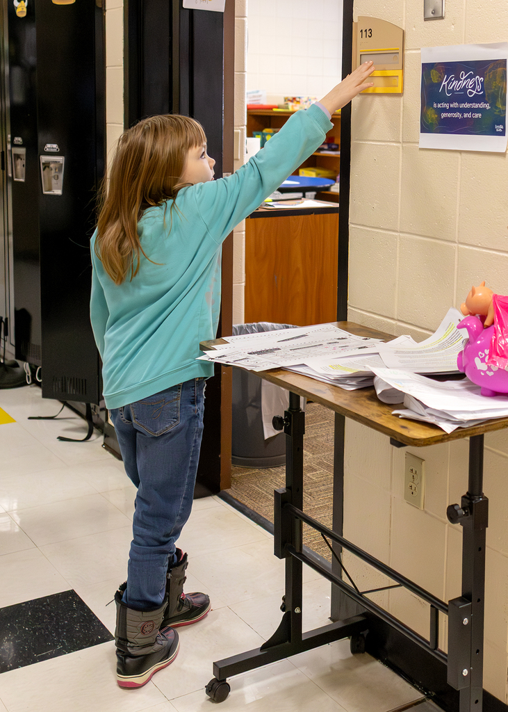 Students learning about Braille