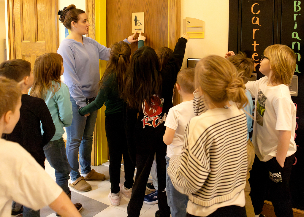 Students learning about Braille
