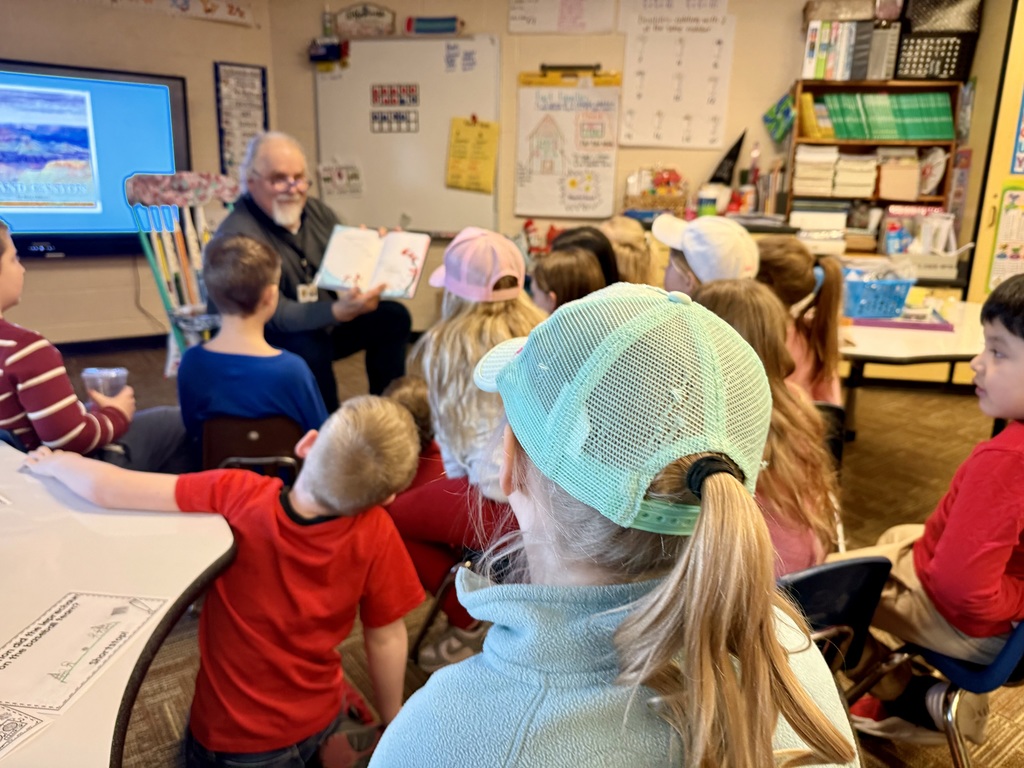 Mr. Foor-Pessin reading to the first grade class