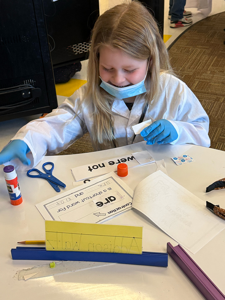 A first grade student performs contraction surgery