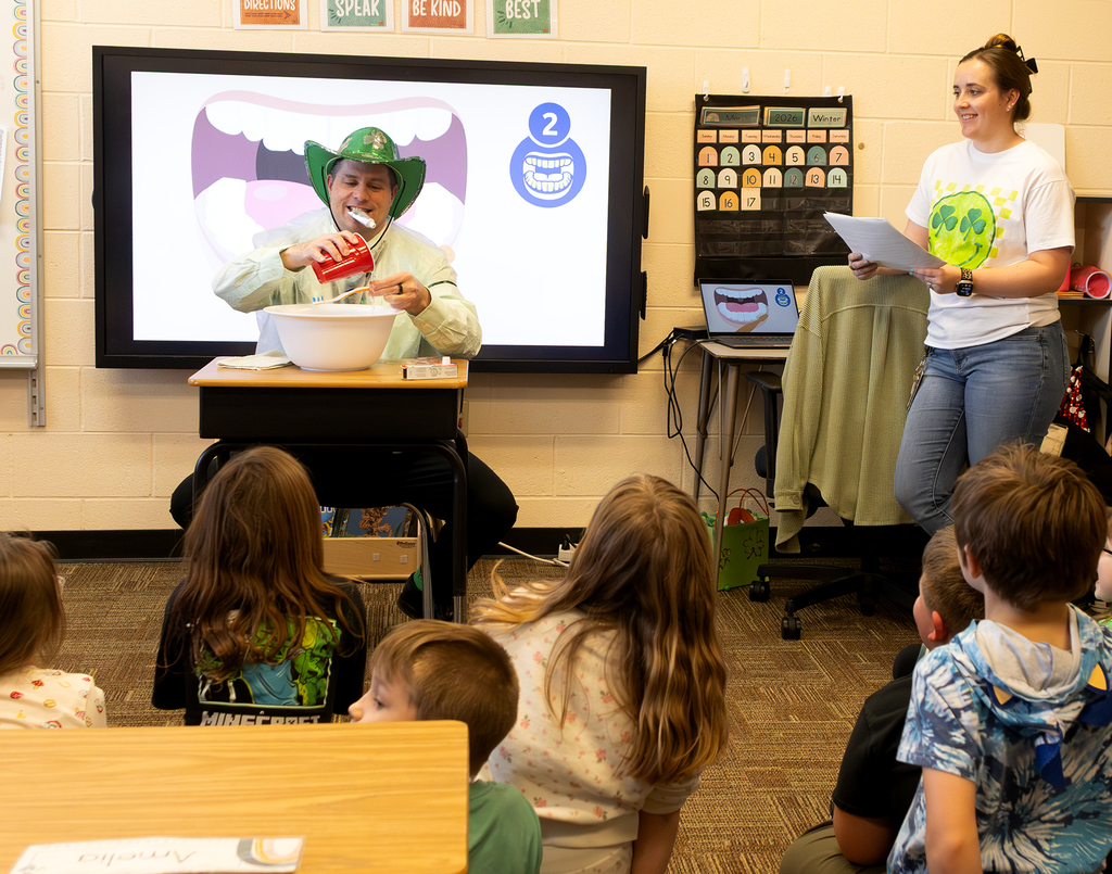 Mr. Gross putting water on a brush