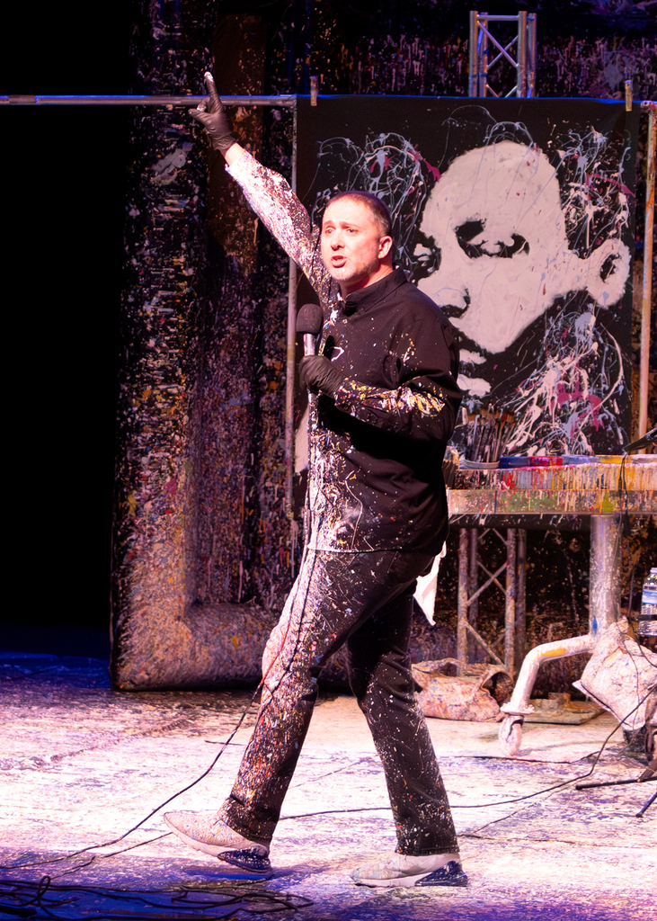 Tom talking on stage