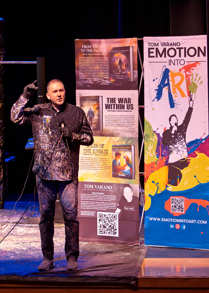 Tom talking on stage