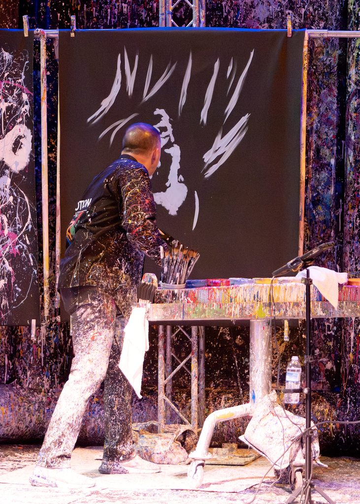 Tom painting a portrait to music