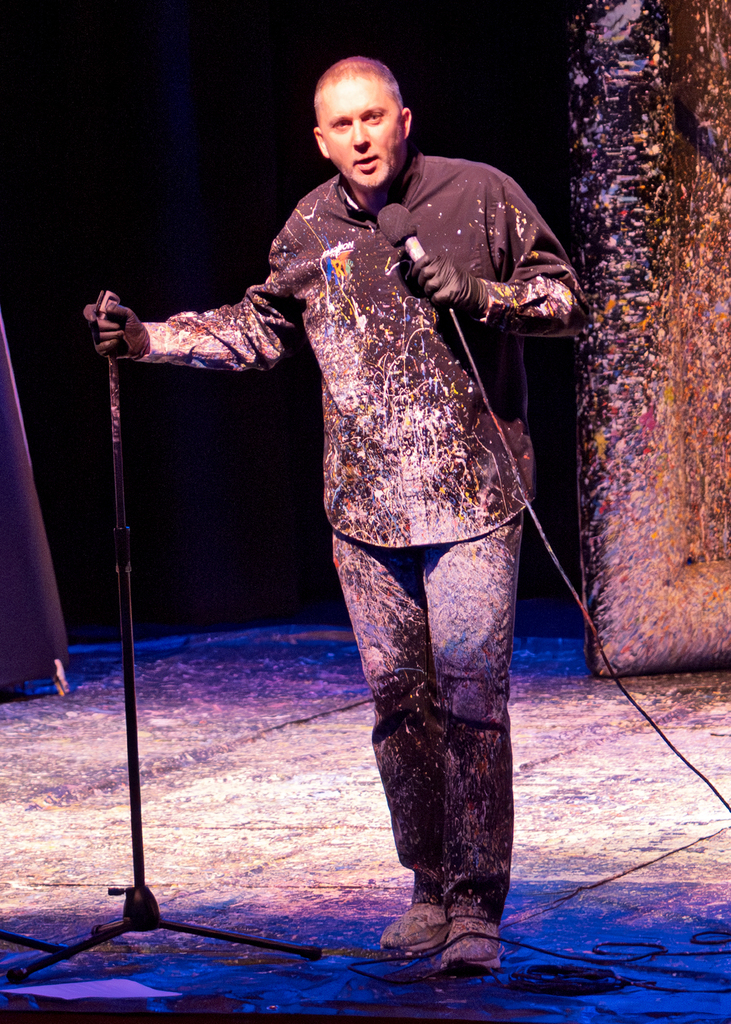 Tom talking on stage