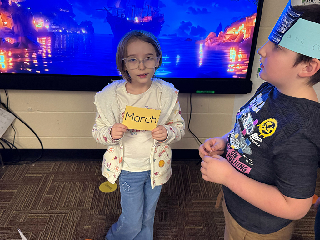 Students hold AR words to show