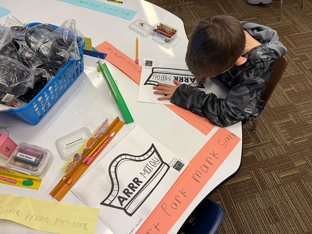 A student writes out an AR word