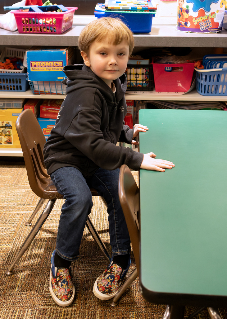 A student keeps his egg warm