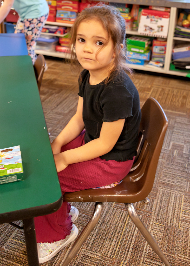 A student keeps her egg warm