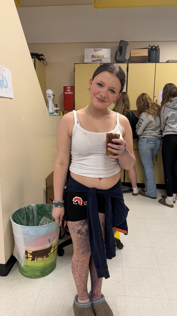 Students in a 6th grade cooking class prepare and assemble chocolate strawberry dessert cups 