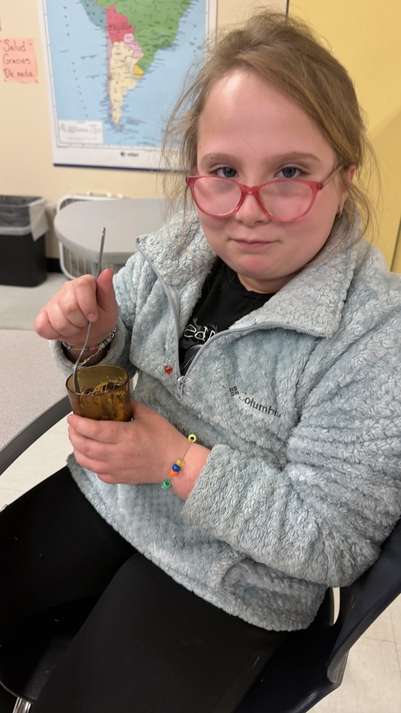Students in a 6th grade cooking class prepare and assemble chocolate strawberry dessert cups 