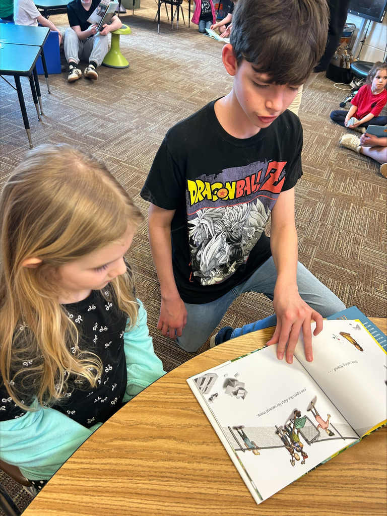 Student actors perform and read books about bravery to elementary students during a classroom visit.