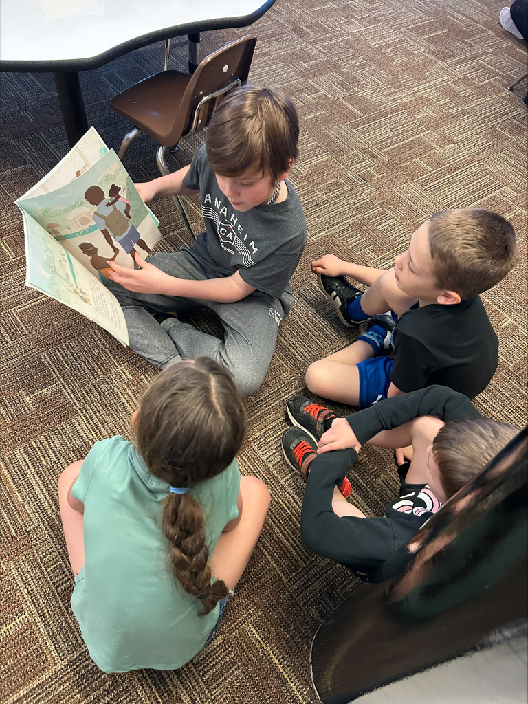 Student actors perform and read books about bravery to elementary students during a classroom visit.