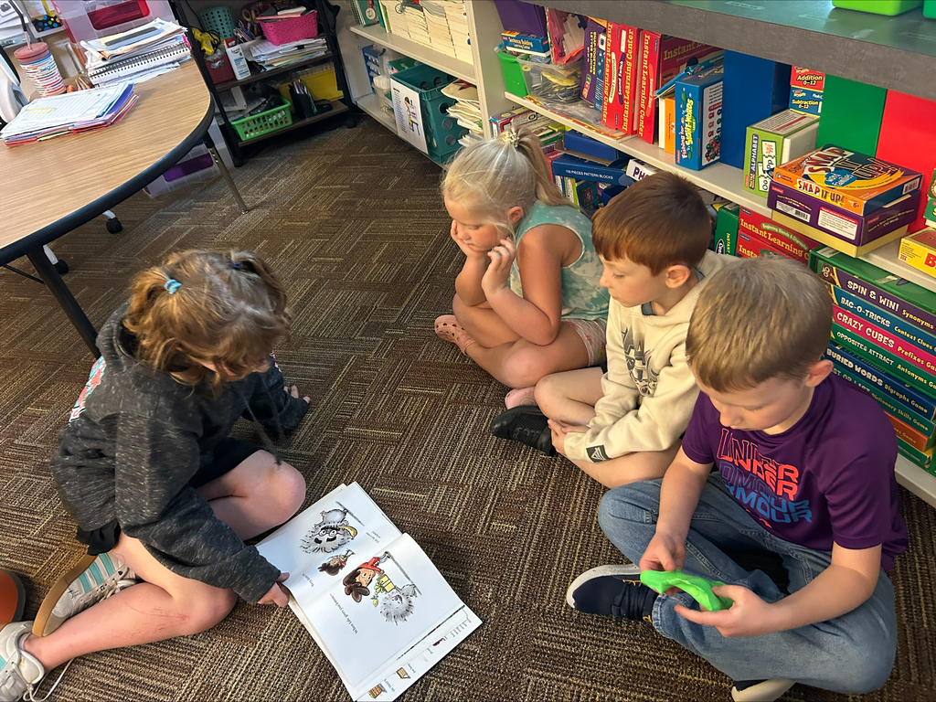 Student actors perform and read books about bravery to elementary students during a classroom visit.