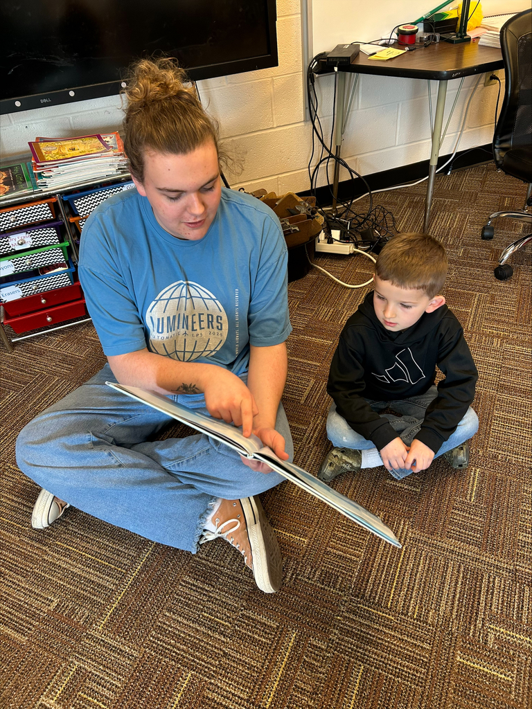 Student actors perform and read books about bravery to elementary students during a classroom visit.
