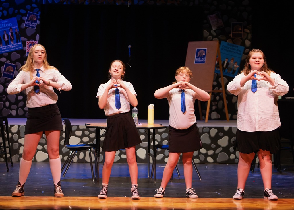 The cast of Emma singing