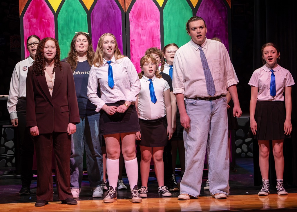 The cast of Emma singing 