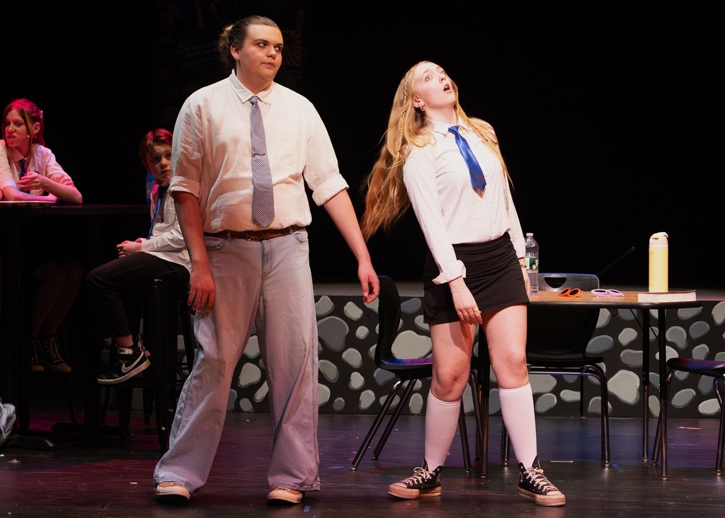 The cast of Emma singing 