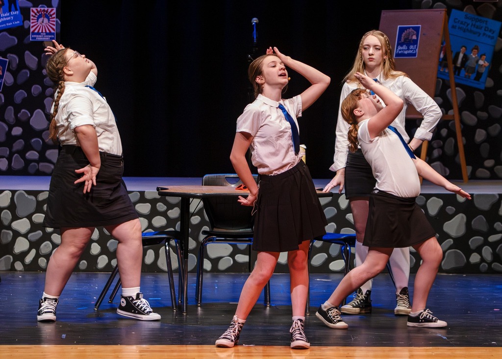 The cast of Emma dancing