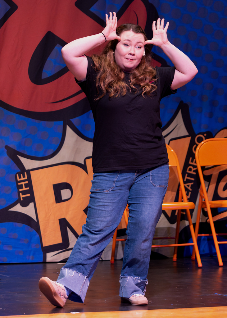 The REV cast on stage performing