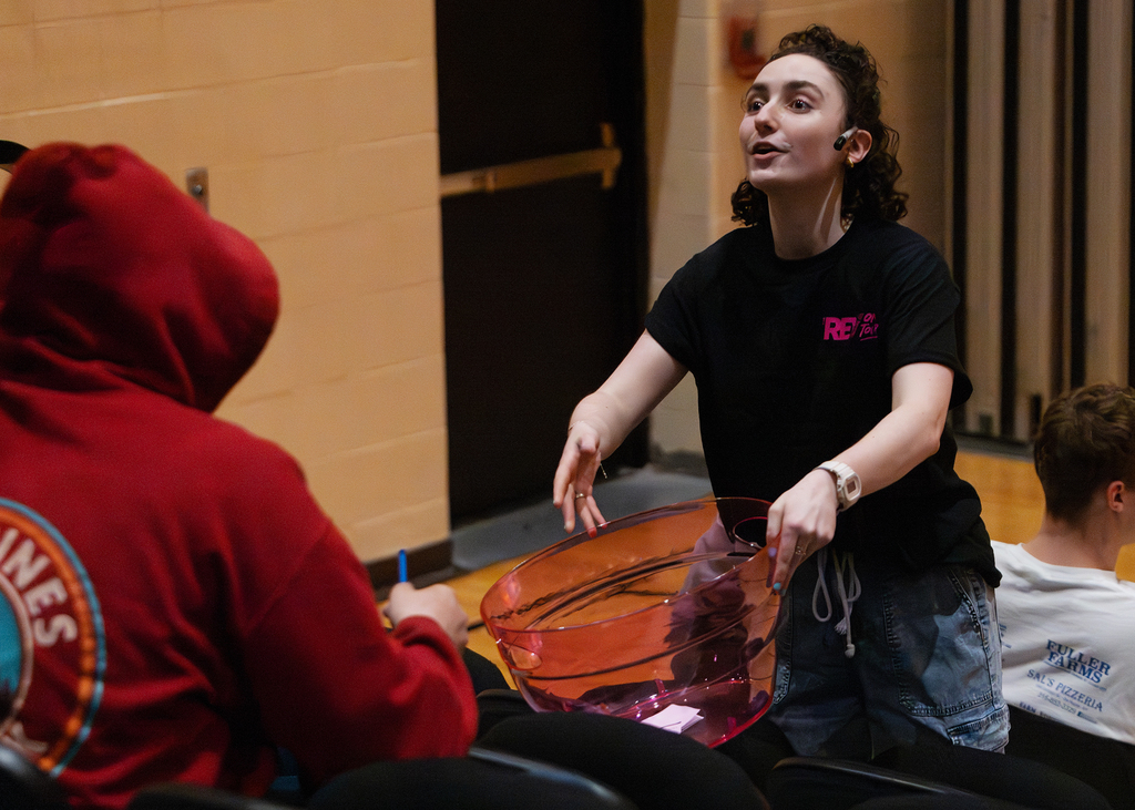 A REV Theatre performer talks to students